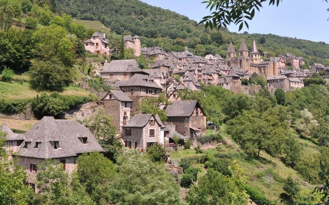 French countryside village with vineyards symbolising retirement in France and expat living.